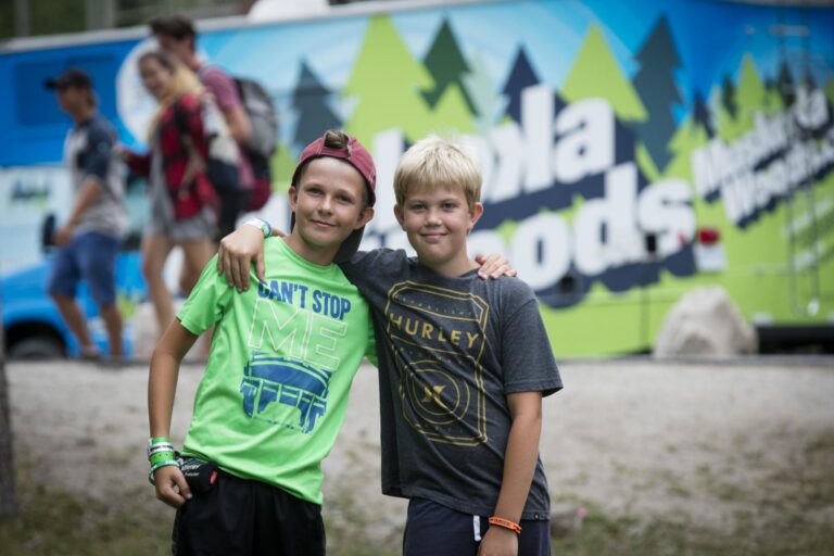 two young boys with their arms around each other