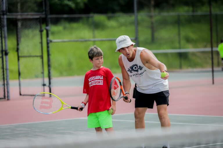 two people play tennis