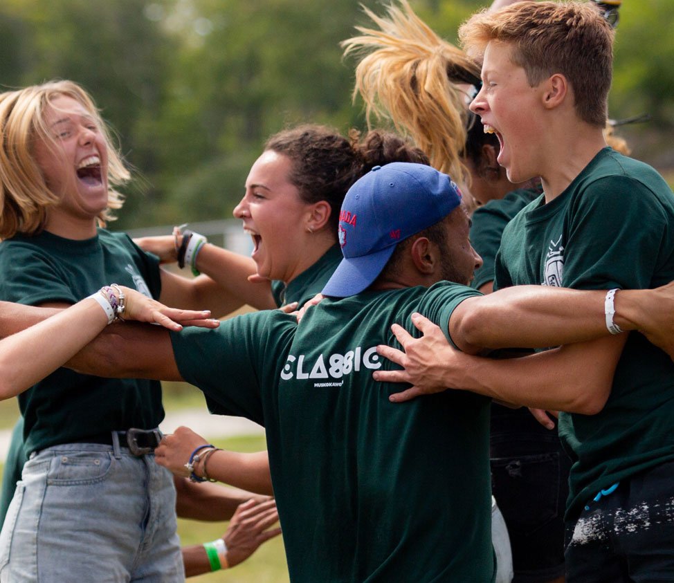 teenagers in green shirts