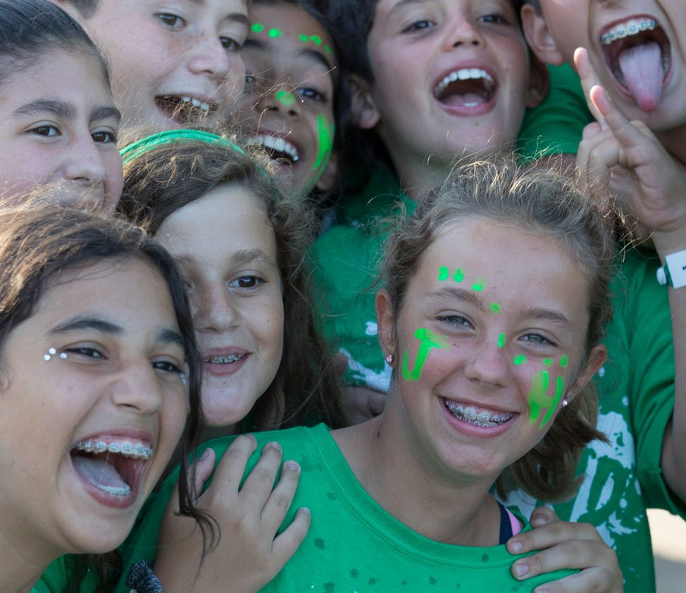 teenagers in green shirts
