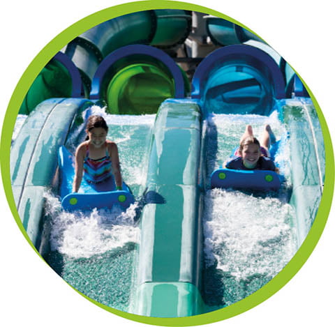 kids sliding down a waterslide 