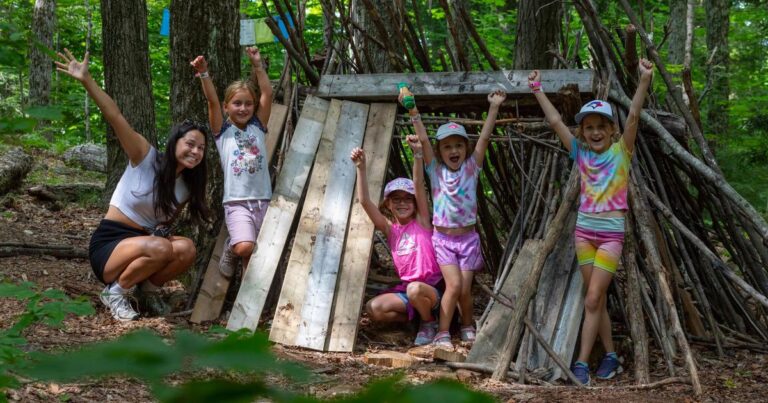 Guests enjoying the great outdoors with a counsellor at Muskoka Woods