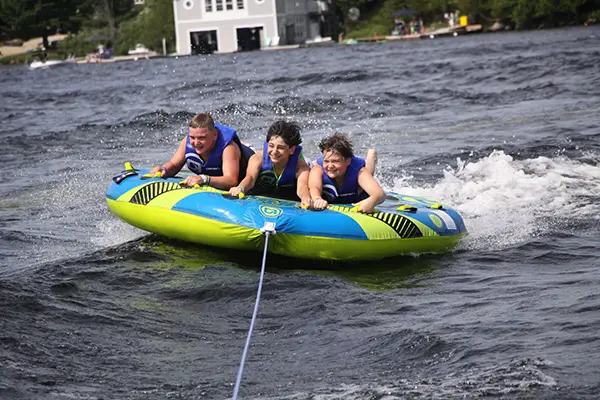 tubing at Muskoka Woods Three kids tubing